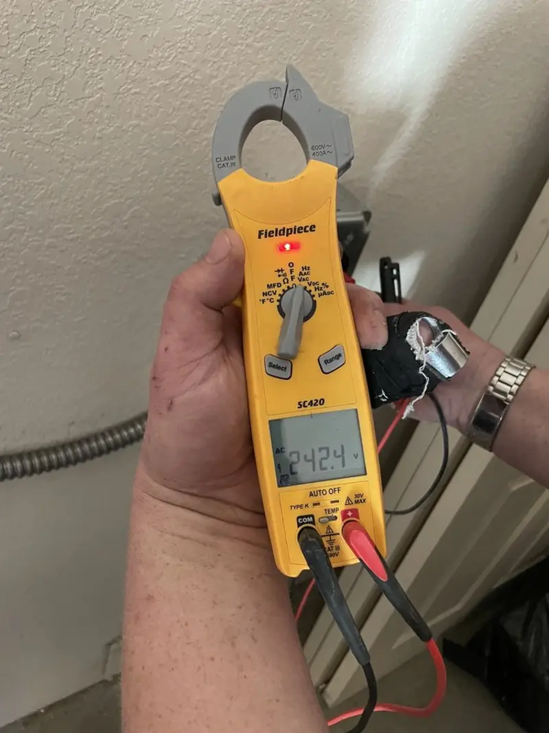 Voltage testing with clamp meter during Ceiling Fan Installation in San Luis Obispo